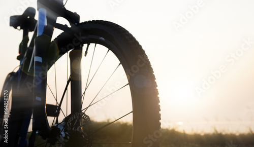 Close up of bicycle park at countryside in the morning with lens flare effect