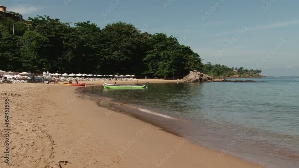 Shot of the sandy beach in Ilhabela, Brazil Shot of the sandy beach in Ilhabela, Brazil