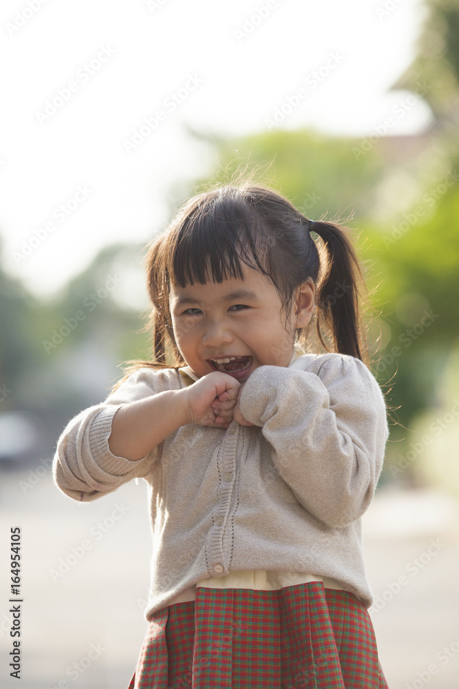 lovely face of asian children laughing outdoor