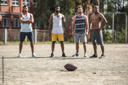 group of young multicultural male football players on court © LIGHTFIELD STUDIOS