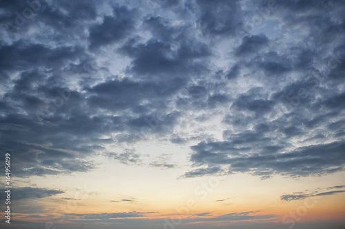 Dramatic dark cloudy sky over sea, natural photo background. Dark storm clouds background