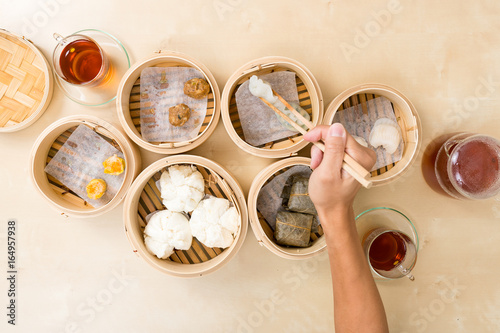 Slika na platnu Top view of eating dim sum