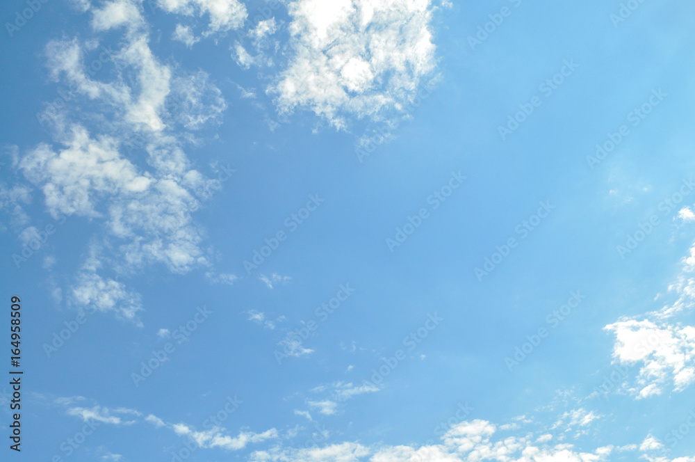 Background with a blue sky and white clouds. White fluffy clouds in the blue sky
Background with a blue sky and white clouds. White fluffy clouds in the blue sky
