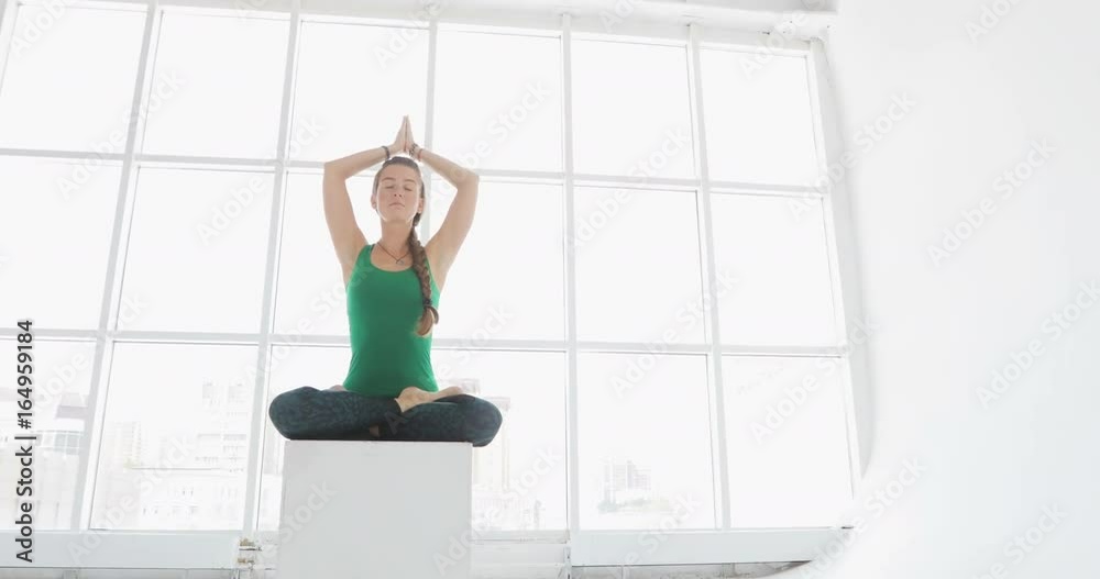 Yoga class of women exercising healthy lifestyle in fitness studio. Fit women doing yoga in fitness hall Yoga class of women exercising healthy lifestyle in fitness studio. Fit women doing yoga in fitness hall