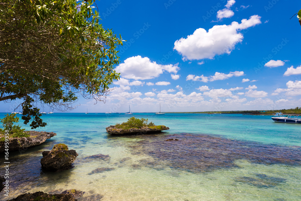 Fototapeta premium View of the stony beach in Bayahibe, La Altagracia, Dominican Republic. Copy space for text.