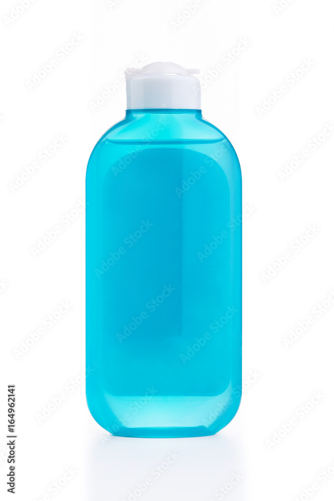 The blue plastic bottle with blue empty label isolated on white The blue plastic bottle with blue empty label isolated on white