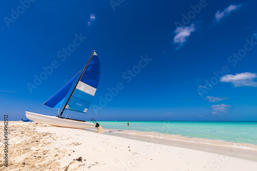 Sailboat on the sandy beach of the Playa Paradise of the island of Cayo Largo, Cuba. Copy space for text.
