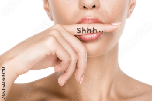 cropped view of beautiful woman with shh symbol, isolated on white photo