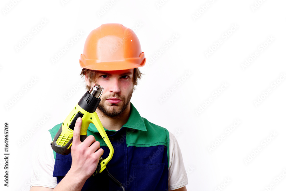 Building and finished work concept. Man with beard, serious face Building and finished work concept. Man with beard, serious face
