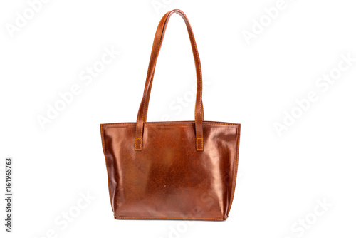 Elegant brown leather woman's handbag isolated on white background 