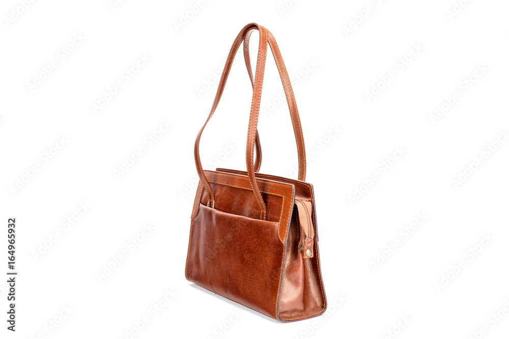 Elegant brown leather woman's handbag isolated on white background.
