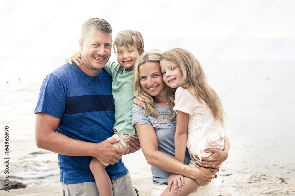 Beautiful happy family on the beach Beautiful happy family on the beach