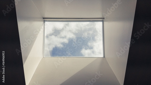 Bilde på lerret Modern interior skylight showing grey sky and misty clouds