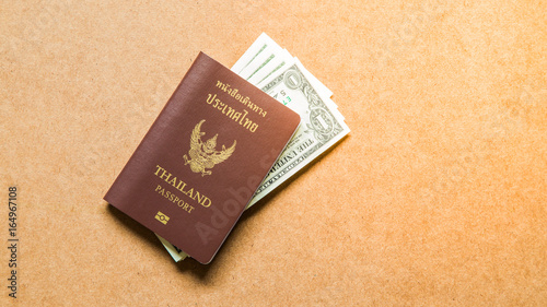 Thailand passport with dollar money