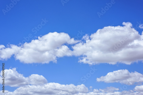 Fototapeta Naklejka Na Ścianę i Meble -  Beautiful big white clouds over blue sky, sunny summer day, close up