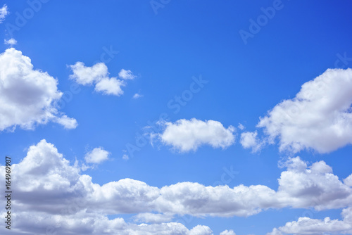 Beautiful big white clouds over blue sky  sunny summer day  close up