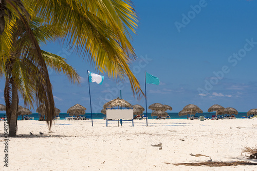 Banner on the beach Playa Sirena of the island of Cayo Largo, Cuba. Copy space for text. © ggfoto
