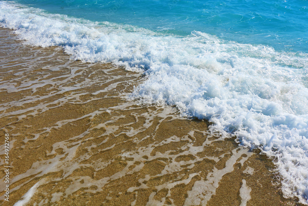 Sand on the beach and sea foam