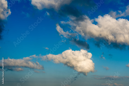 Fantastic white clouds against blue sky © StepStock