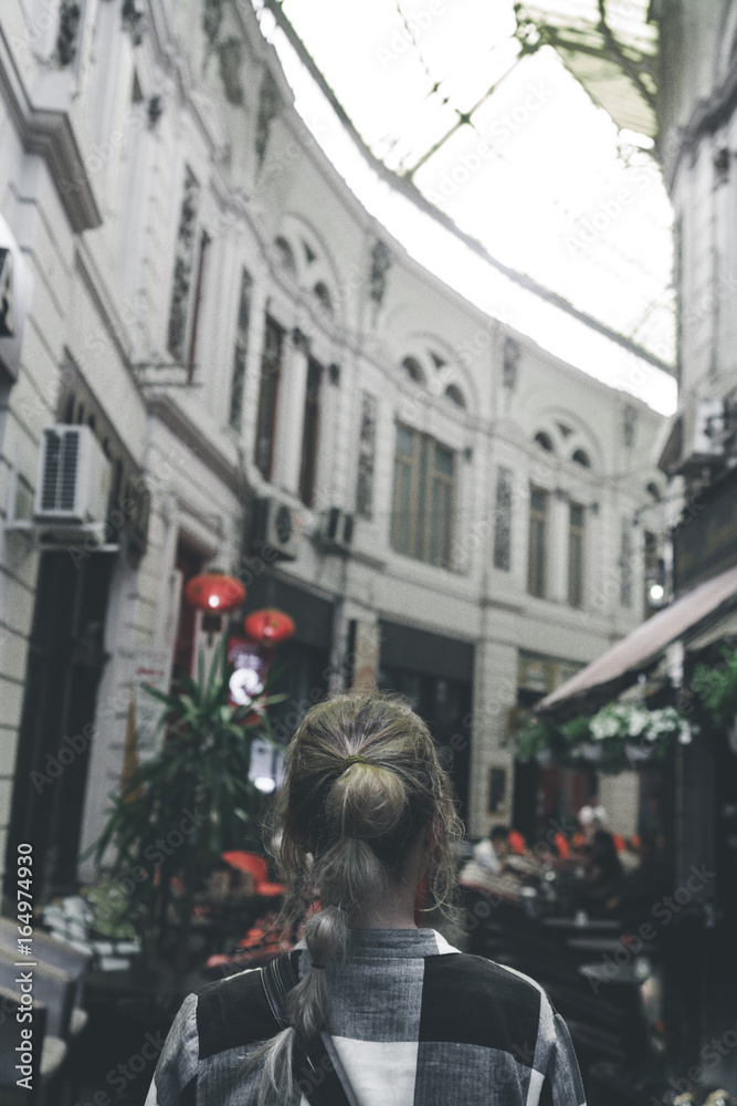 Girl walking on old streets of Bucharest. Romania. Europe. Traveler. City Brake