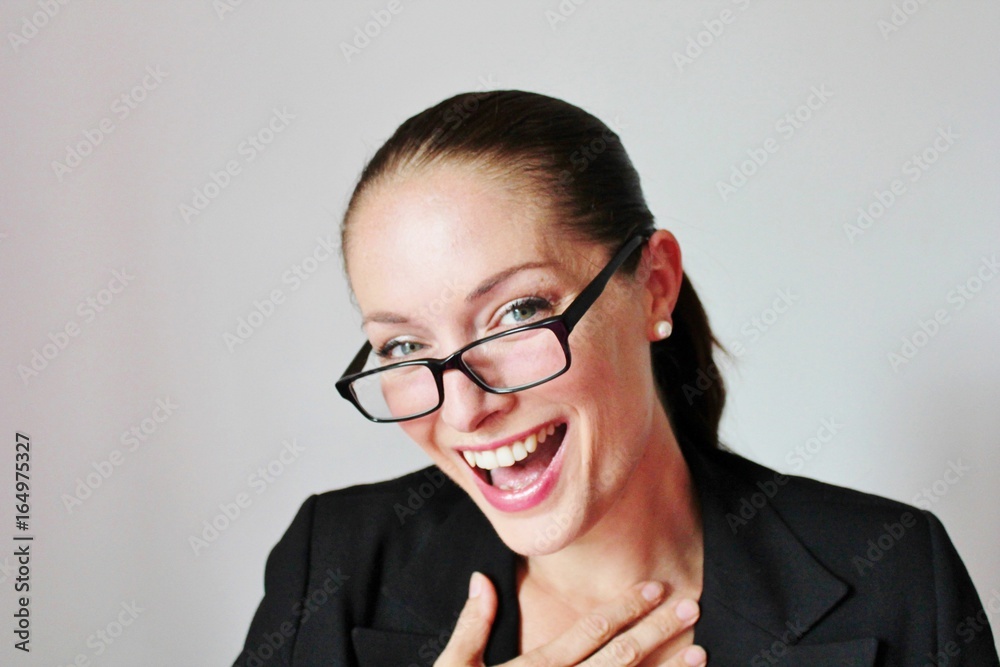 happy woman laughing Attractive good looking Business woman in glasses happy woman laughing Attractive good looking Business woman in glasses
