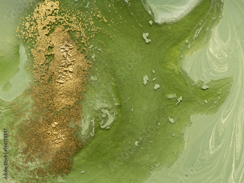 Marbled green and gold abstract background. Liquid marble pattern