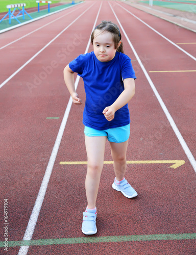 Little girl have fun on the stadium