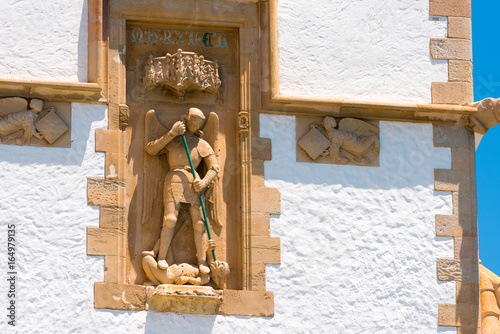 Sculpture and bas-reliefs on the building of the Museum Marisel de Mar, Sitges, Barcelona, Catalunya, Spain. Close-up. photo