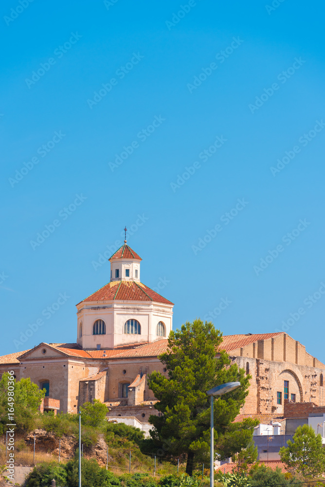 View of Mont-roig del Camp and the church of St. Miguel, Tarragona, Catalunya, Spain. Copy space for text. Vertical.