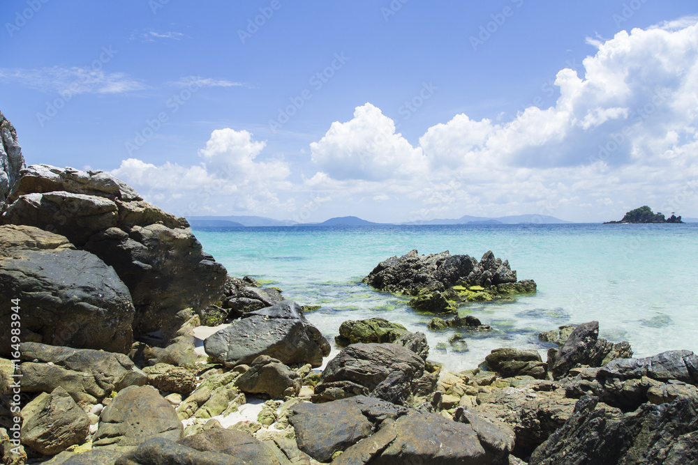 Andaman Sea, emerald sea, blue sky and exotic rocks.