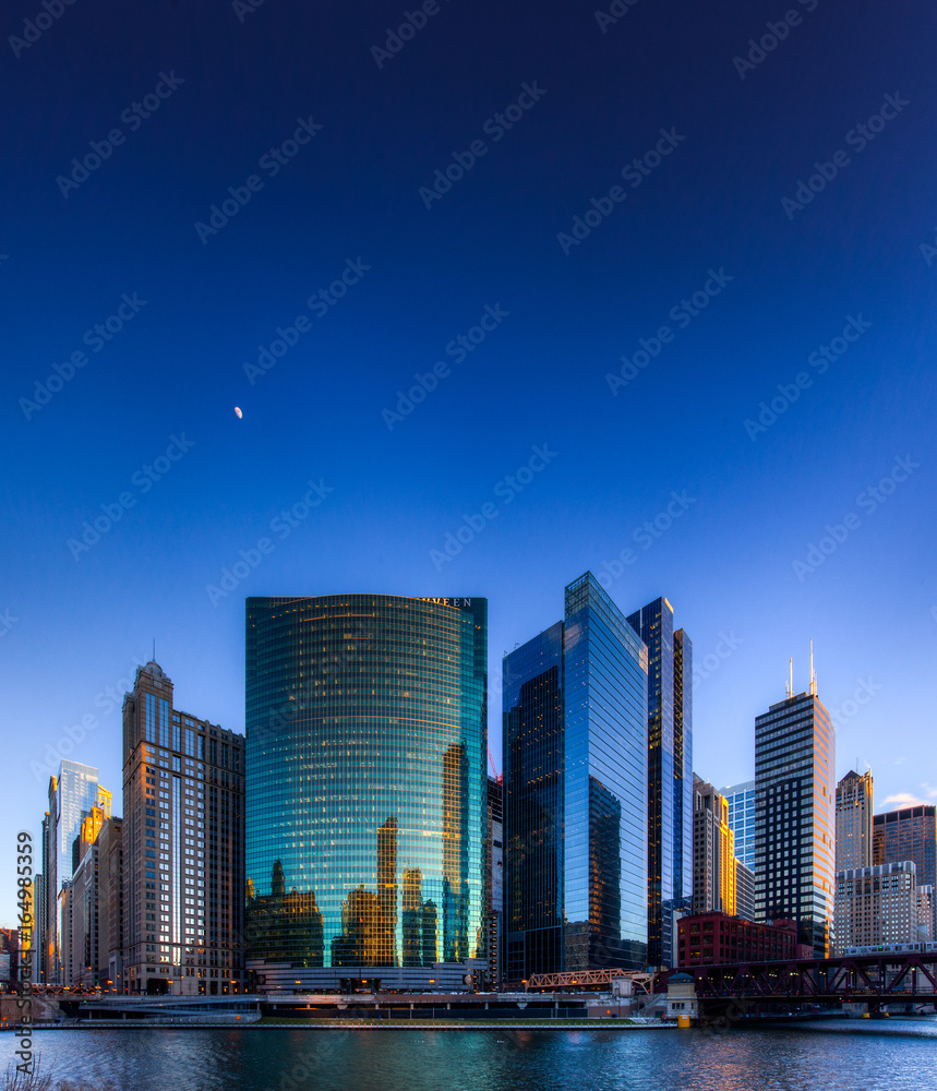 Chicago buildings with moonrise at river Intersection
