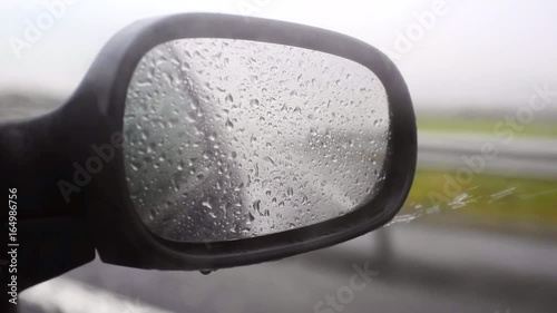 Raining on a mirror while driving a car