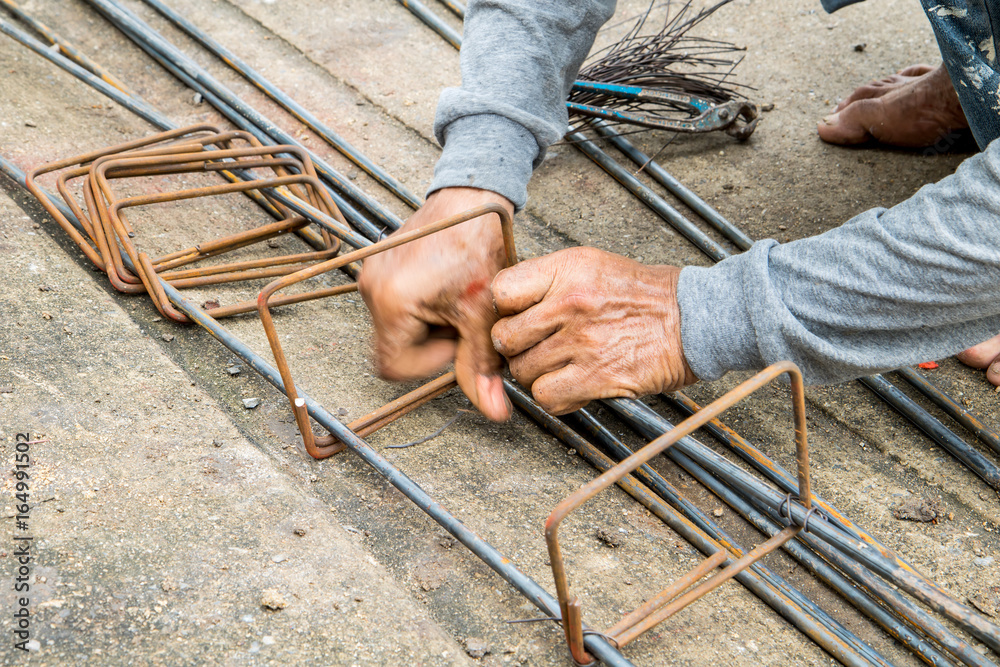 Labor is tying steel for construction site Labor is tying steel for construction site