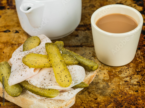 Fototapeta Naklejka Na Ścianę i Meble -  Sliced Roast Turkey With Gherkin Pickles Open Sandwich