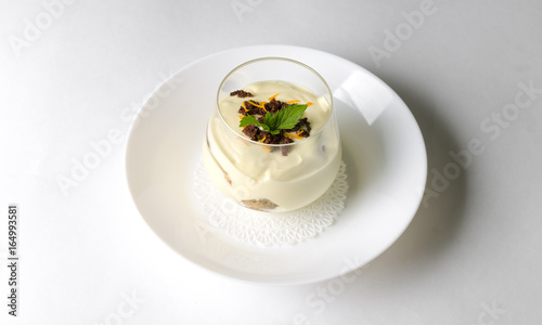 Dessert tiramisu with mint in a transparent glass