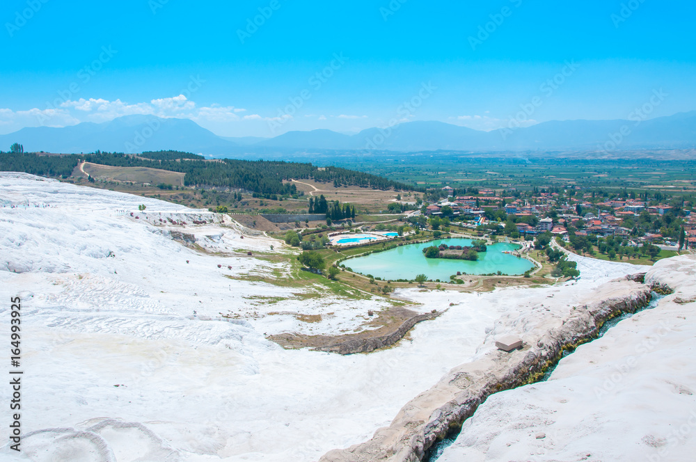 Thermal springs and terrace in a spa resort. Natural travertine pools and terraces in Pamukkale. Cotton castle in southwestern Turkey.