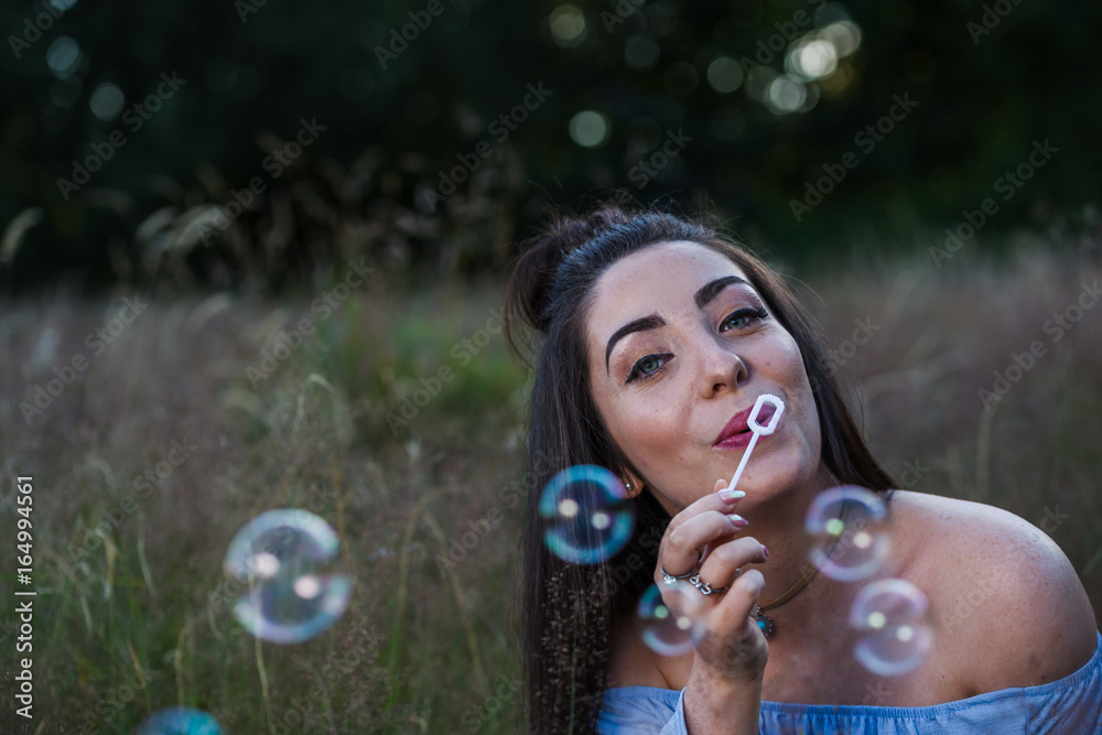 Blowing bubbles in a meadow