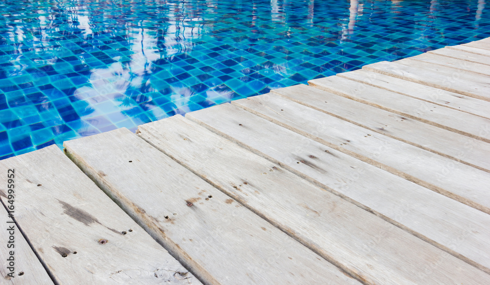 perspective view wooden floor at the swimming pool