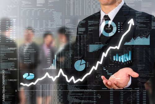 businessman showing uptrend business screen
