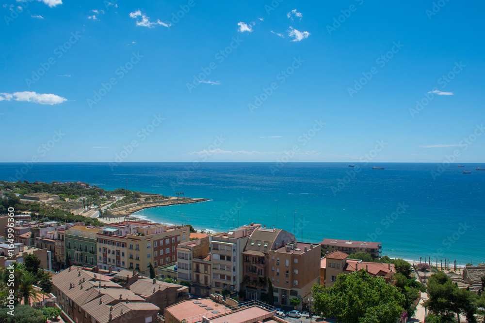 the sea and the rooftops of the city of tarragona