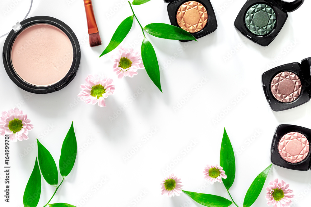 Makeup kit. Eyeshadows, brushes, blushes on white table background top