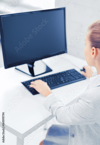 businesswoman with computer in office