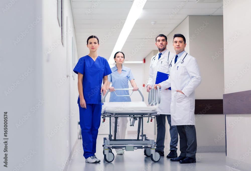 group of doctors with gurney at hospital