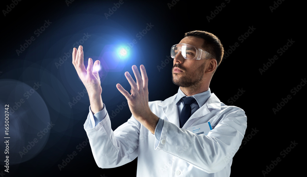scientist in lab coat and goggles with light scientist in lab coat and goggles with light