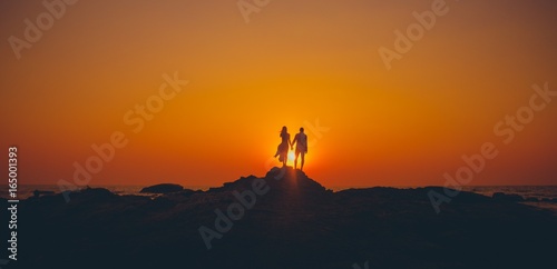 the loving couple meets a sunset