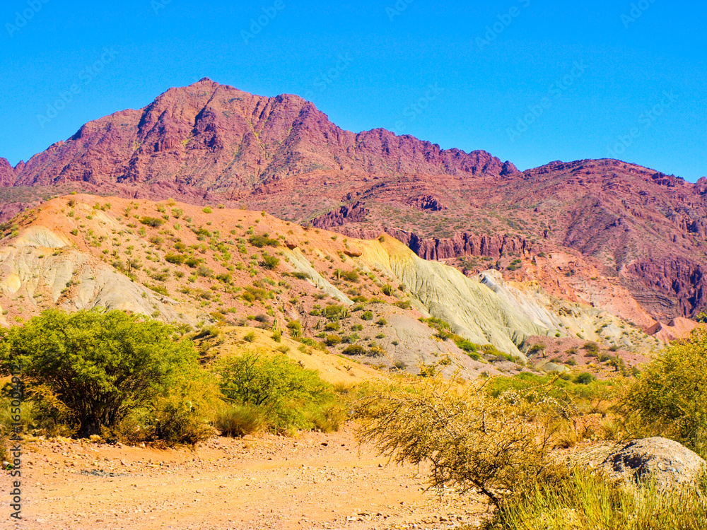 Western-like landscape with red rock formations in dry Quebrada de Palmira near Tupiza, Bolivian Andes, South America. Western-like landscape with red rock formations in dry Quebrada de Palmira near Tupiza, Bolivian Andes, South America.