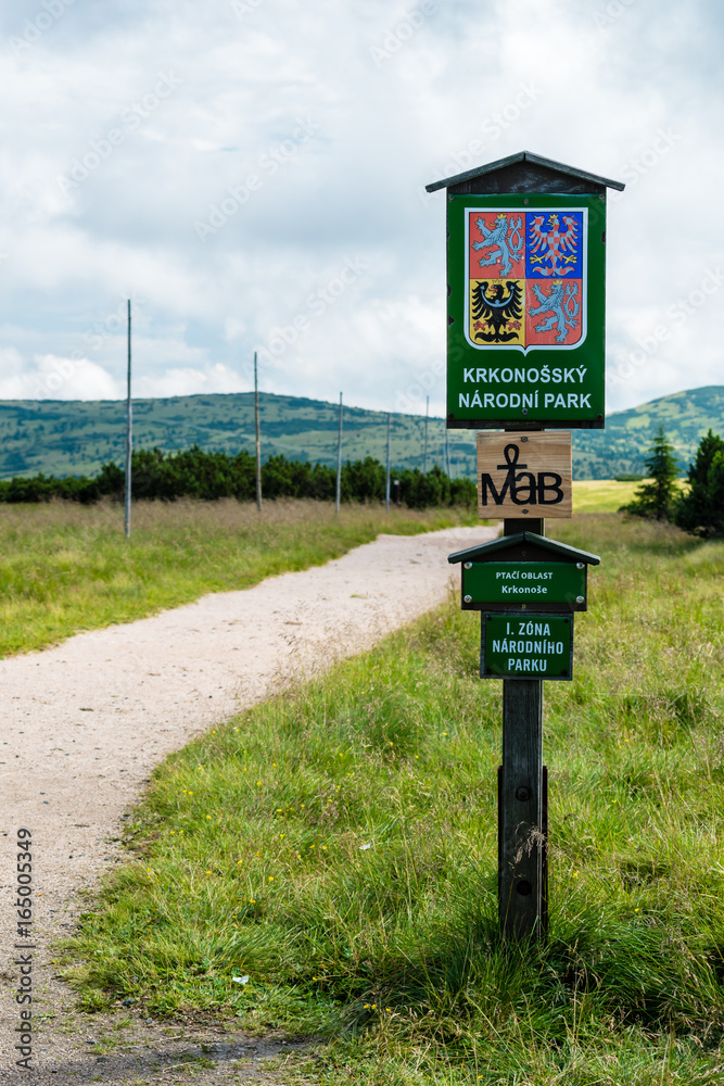 The wooden sign informs of Giant Mountains National Park The wooden sign informs of Giant Mountains National Park
