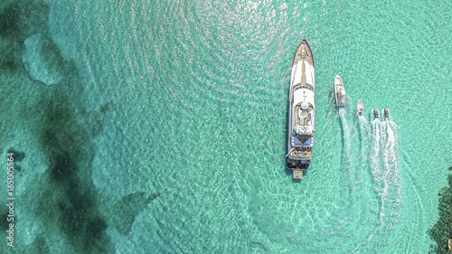 Aerial view of boats and yacht moving in sea at Sandy Toes island photo