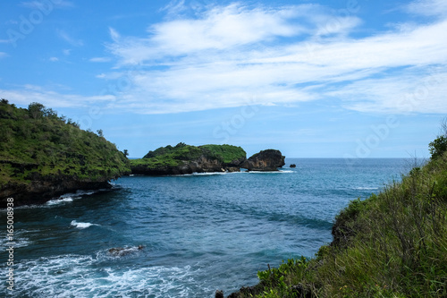 perfect destination for vacation - tropical green rocks and small islands close to the shore close to Pacitan