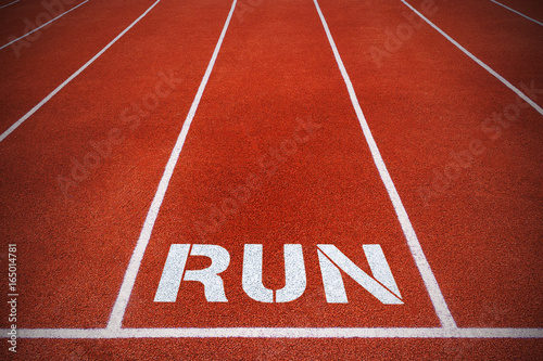 Running tracks with inscription "run" (concept, spotlight)